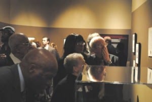 Visitors viewing the "Without Sanctuary" exhibition at the National Underground Railroad Freedom Center. Photograph by Thadd Fiala 